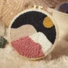 Midnight mountains punch needle coasters kit with colorful mountains design in embroidery hoop and complete crafting supplies