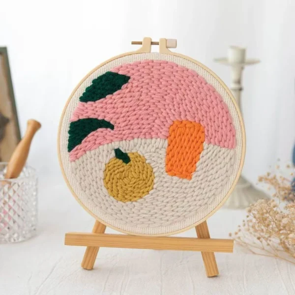 Sweet orange punch needle embroidery kit with hoop, yarn, and pre-printed fabric design for beginner crafters