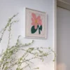 Framed punch needle pink flower embroidery kit hanging on wall, perfect for floral wall decor