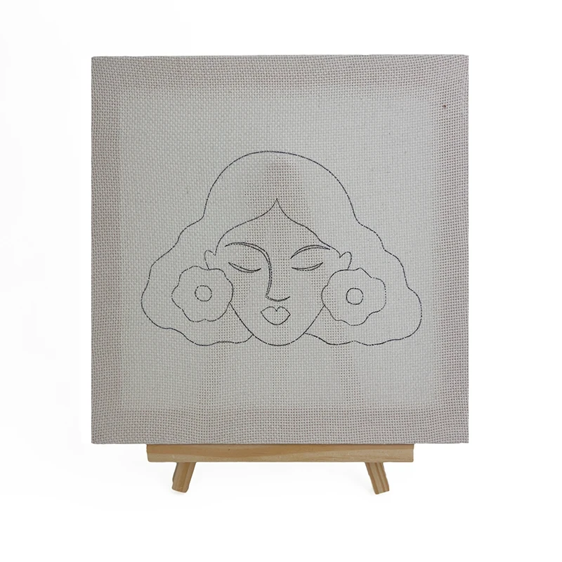 Frida Kahlo wall art pattern drawn on fabric for punch needle embroidery, featuring iconic portrait with flowers on easel