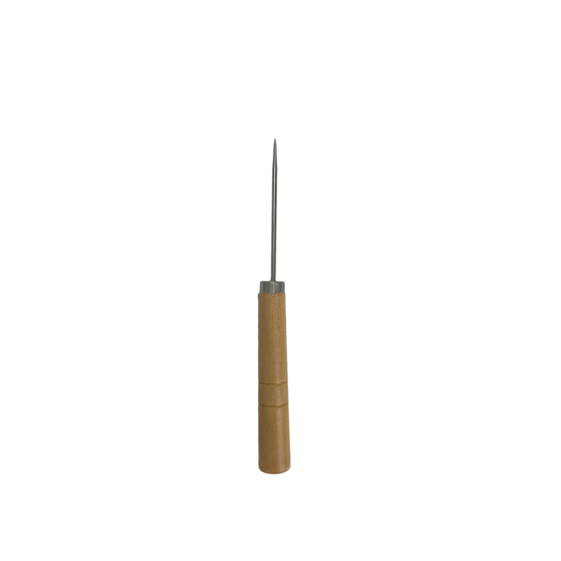 Using a wooden awl to separate yarn loops and adjust details.