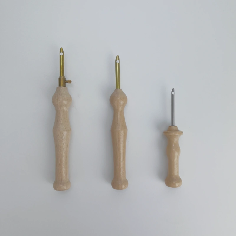 Comparing punch needles of different sizes for various yarn thicknesses.